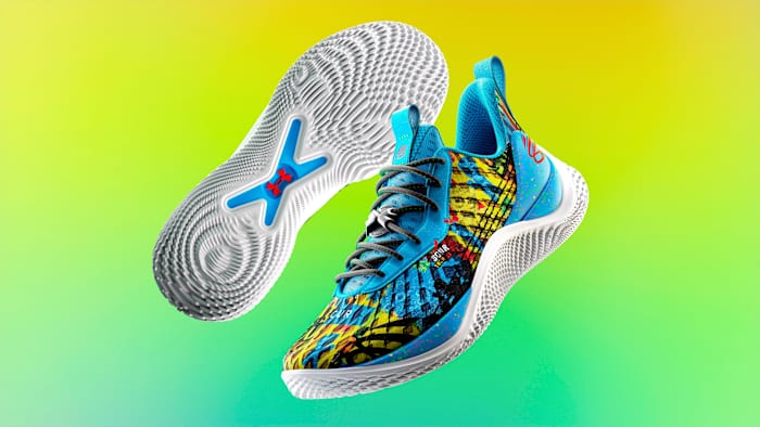 View of blue, yellow, and white Curry shoes.